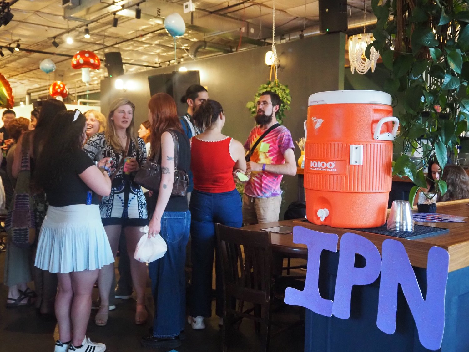 IPN members socializing at a conference mixer